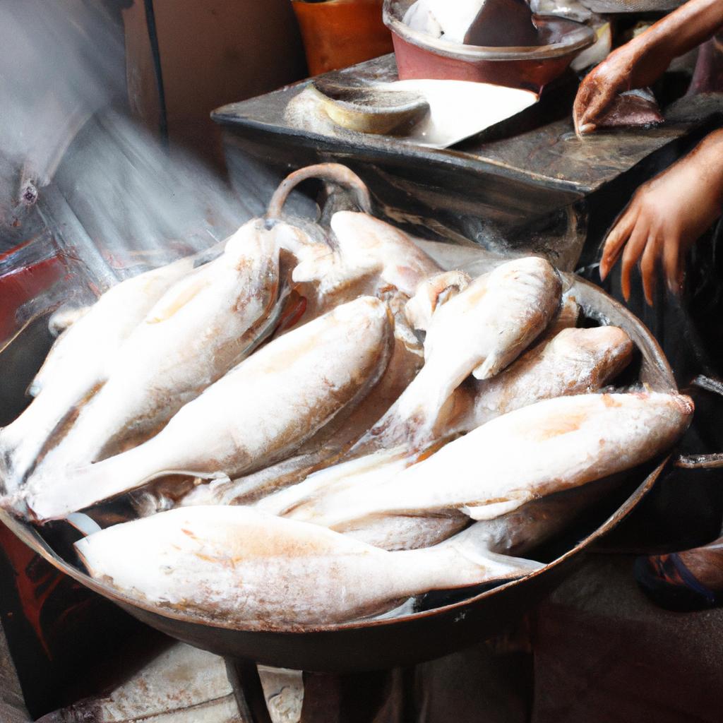 Person steaming fish at market
